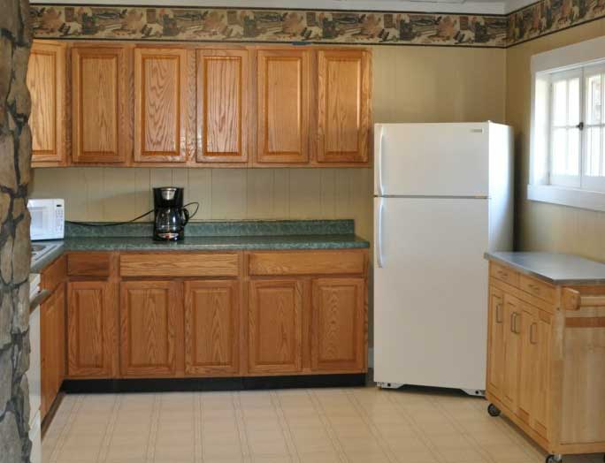 Kitchen with White Fridge and Coffee Maker
