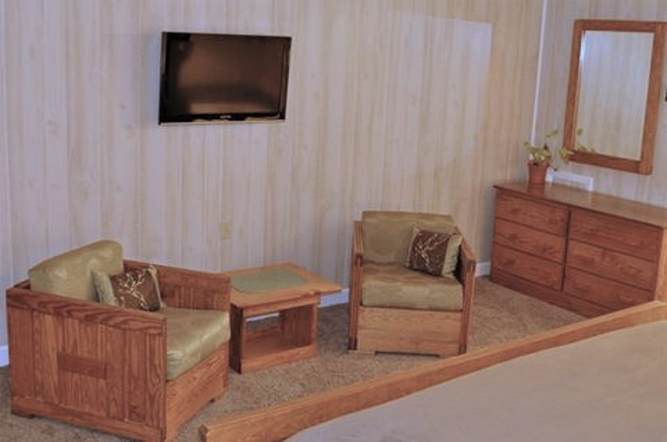Two Chairs with Green Cushions